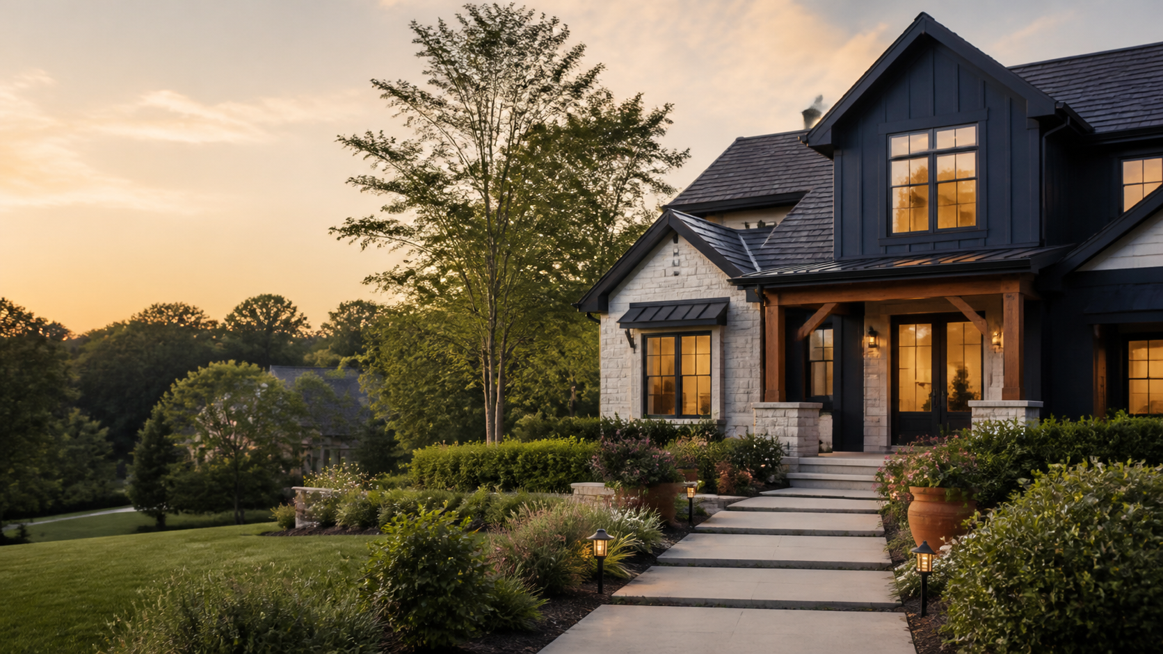 Modern home exterior with a landscaped entrance at golden hour